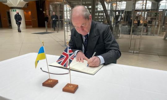 Sir Geoffrey Clifton-Brown signs the Ukraine book of solidarity in Westminster 